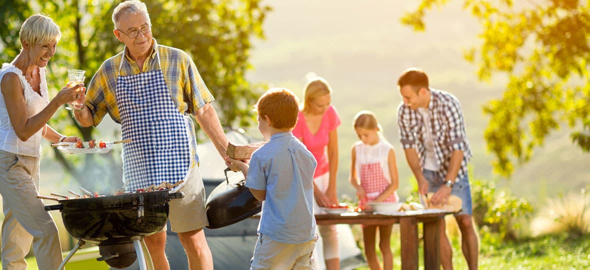 A multi-generational family having a cookout.