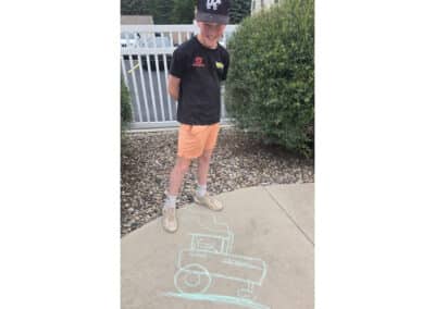 Youth with tractor chalk drawing