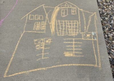 House and parking lot chalk drawing